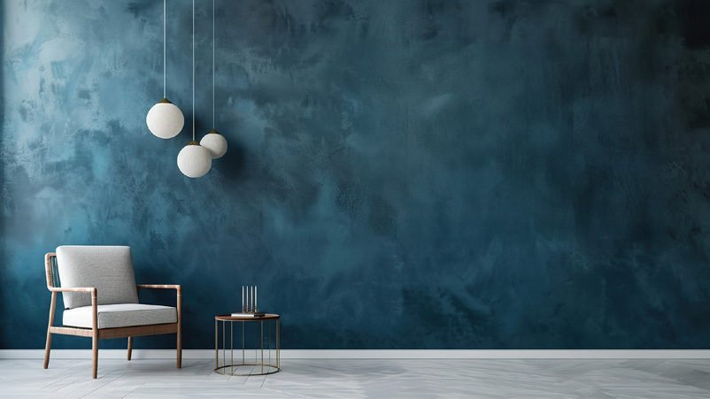 Interior with textured blue wall and pendant lighting